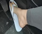 Sweaty feet in really tasty flip flops pedal pumping on the pedals of the car from blue high heel and pedal pupin