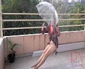 The lady is swinging on a rope swing, hiding from the rain under an umbrella. from nudist pure nudism family boysarina kapur kareena kapoor nude