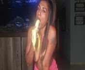 Topless desi squeezes her boobs as she sucks and deepthroats on a banana from desi college captured topless while bathing