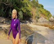 Katerina Piglet is walking on the beach wearing latex body from katerina stikoudi